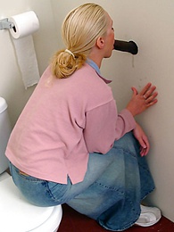 Free-FreePorn.com presents: Blonde girl Jamie sits on the toilet and blows a black gloryhole dong